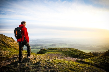 Walker standing at the top of The Wrekin